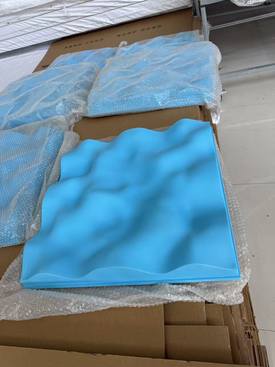 Actual blue cloud diffuser sample showing its curved surface and perimeter